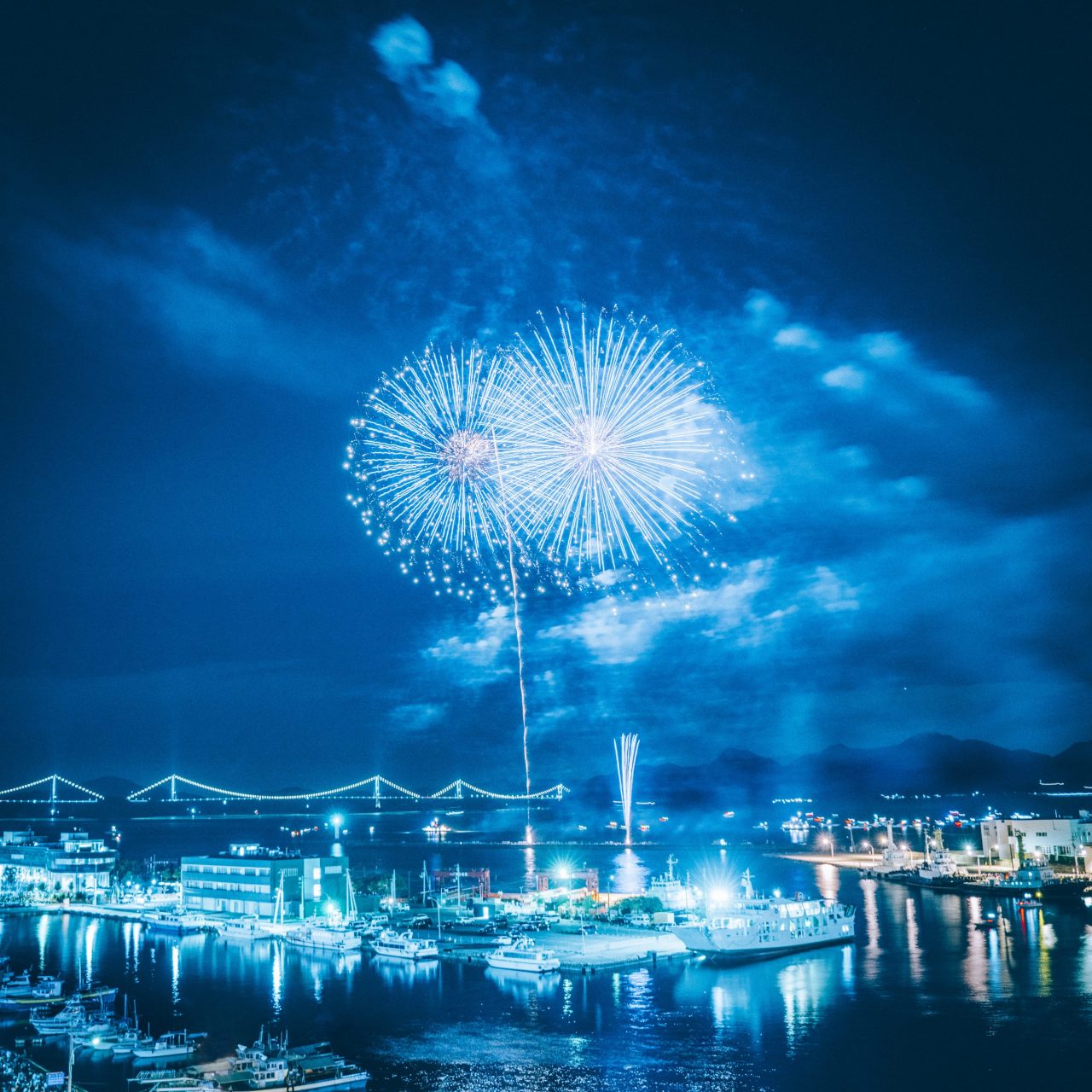 Yuzutsu — official RADWIMPS single artwork showing fireworks above Imabari harbor